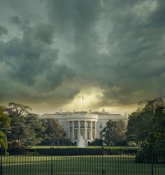 The White House in Washington DC under dark stormy clouds