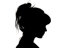 silhouette portrait of sad beautiful profile of female head with hairstyle on white isolated background with wavy gathered hair, concept beauty and fashion