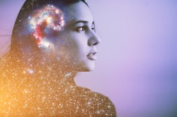 Double multiply exposure abstract portrait of a dreamer cute young woman face with galaxy universe space inside head. Spirit cosmos astronomy life zen concept Elements of this image furnished by NASA
