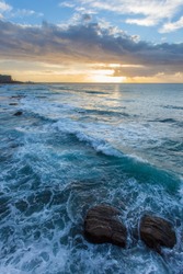 Sunrise at Newcastle Beach - New South Wales Australia. Located on the coast a few hours north of Sydney Newcastle is the largest regional  city in Australia.