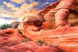 Dramatic Red rock sculpture with sunset in background