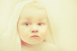 Baby boy portrait photo. Jesus baby picture for Merry Christmas. Fatty toddler with white towel on head after bath or shower.  Kid in sauna and bathing