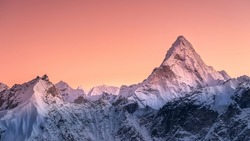Panoramic view to summit Ama Dablam and snow peaks with beautiful light after sunset in Nepal