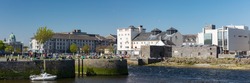 GALWAY CITY, IRELAND - 5th May, 2018: Panorama of Galway city at the mouth of the Corrib river, View of Galway Cathedral in the distance.