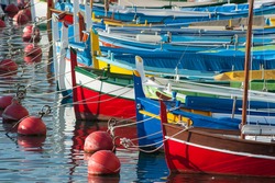 colourful boats docked in the port of nice in the south of France