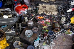 Machine,motor,tool, and more assembly pile up in garage like junk. 
