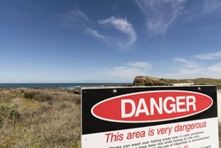 Danger Sign/ the danger sign at The Bluff along 90 mile beach, Far North, NZ 