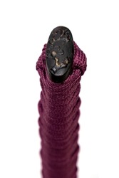 Sakurai design Kashira : butt cap (or pommel) made of steel on the end of the purple silk cord handle Japanese sword isolated in white background. Selective focus.