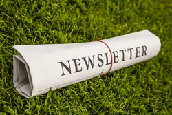 newsletter newspaper on a green meadow