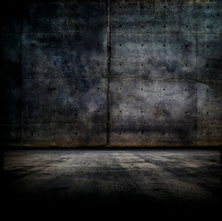 Black room.  Dark concrete wall and floor. 