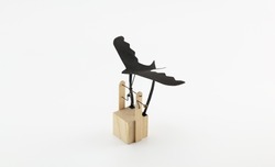 Flying bird automata or gadget with flying black bird. Isolated on neutral white.
