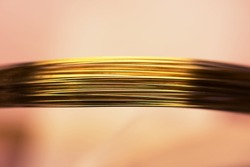 Thin gold wires high magnification macro. Shallow depth of field.