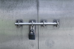 Grungy steel door with lock