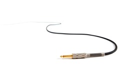 Studio audio or instrument cable extending and disappearing in to a white background. 1/4 inch phone connector.