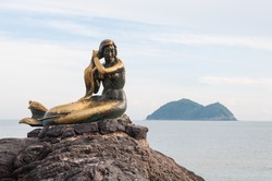 The mermaid statue on the rock at Samilar beach in Songkhla, Thailand