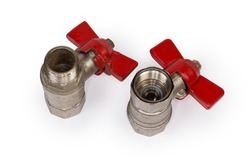 Two ball valves with brass bodies and red butterfly handles stand with threaded connection of various design upwards on a white background 