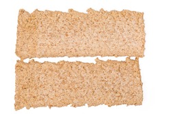Two dry rectangular flat dietary rye-wheat crispbreads on a white background, top view close-up. Background, texture