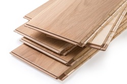 Stack of the three-layer engineered wood flooring boards with white oak face layer, pine core layer and glue-less locking joint system, fragment of butt-end parts close-up 