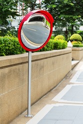 Close up traffic convex mirror near car park entrance
