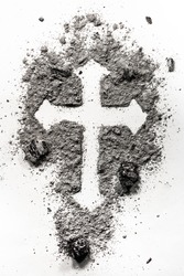 Christian holy cross symbol made in ash, dust as a religion concept