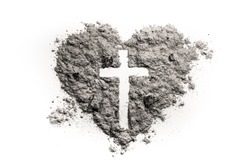 Cross or crucifix in heart symbol made of ash, sand or dust as Jesus Christ christian passion or chrism, lent and Ash Wednesday concept