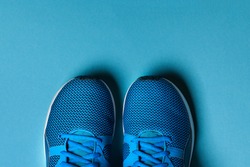 One Pair of blue sport shoes on blue background
