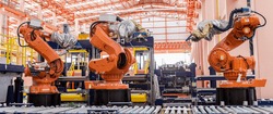 Industrial welding robots in production line manufacturer factory