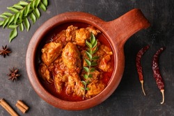 Spicy red chicken curry. Kerala style chicken vindaloo. Butter chicken Murgh Makhani curry Indian spices hot and spicy gravy dish Dhaba Punjab, India. North Indian non-veg cuisine Garam Masala. tikka