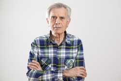 Portrait elderly man on gray background