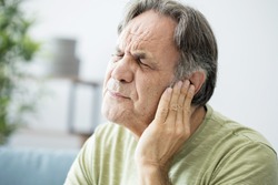Old man with ear pain