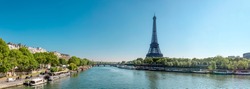 Panorama of Seine in Paris and Eiffel tower in beautiful summer day in Paris, France