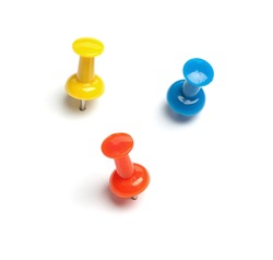 Set of push pins in different colors, with real shadows, isolated on white background.