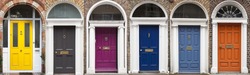 Doors in different colors painted as protest against English King George legal reign over the city of Dublin in Ireland