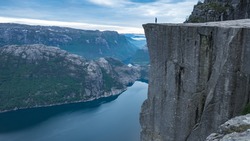 Preikestolen, Norway - May 2016: Man at the top of Pulpit Rock