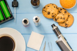 Still life with e-ciggarete and coffe on the wooden background