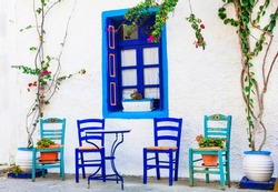 Traditional Greece series - wooden chairs in small street tavernas