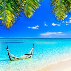 Tropical chilling out - hammock in turquoise water.