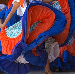 Background with a Costa Rican dancer's dress while dancing.