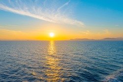 Sunset from ship at Mediterranean Sea during tour in Greece to Greek Islands
