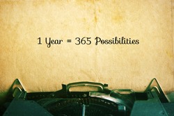 1 Year = 365 Possibilities: Inspiration Motivational Quotes on Vintage Paper Background.