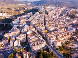 Aerial view of Alcoi cityscape with blue dome of Archpriest church of Santa Maria, Spain