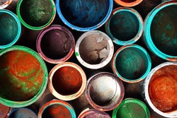 Old dirty paint cans as background