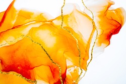 Transparent creativity, modern art. Ink colors are amazingly bright, luminous, translucent, free-flowing, and dry quickly. Natural pattern, luxury. Abstract artwork, trendy style. Orange, 
 gold.