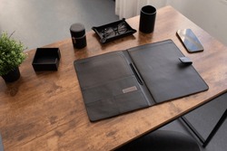 open leather folder for documents on the desktop