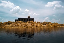 A government building by the lakeside in Putrajaya, Malaysia viewed in infrared