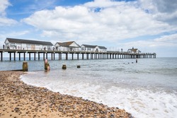 Southwold Pier captured in July 2022 on a beautfiful stretch of the Suffolk coastline on a sunny day.
