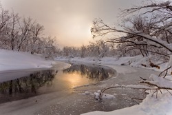 The river in the winter at sunset in Russia on the peninsula of Kamchatka
