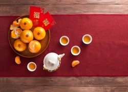 Translation of text appear in image: Prosperity and Spring. Flat lay Chinese new year food and drink still life. Text space image. 