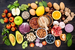Ingredients for the healthy foods selection. The concept of healthy food set up on wooden background.