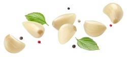 Falling peeled garlic cloves isolated on white background